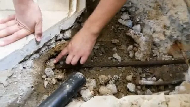 New sewer pipe running through foundation trench during residential plumbing work in Kingman, AZ